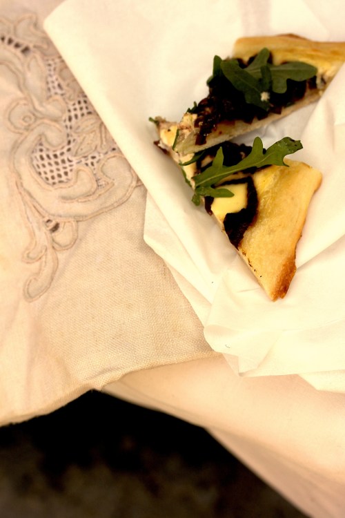 sour cream pizza with red wine onions and rocket